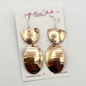 handcrafted bronze earrings with a shell and arentium sterling ear wires
